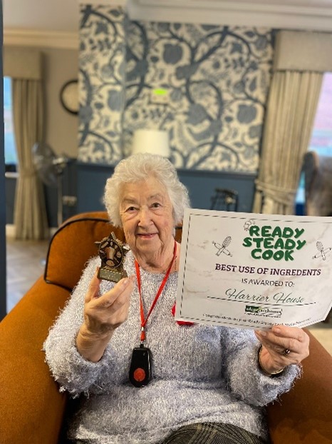 Harrier House Resident Being presented with Ready Steady Cook Award